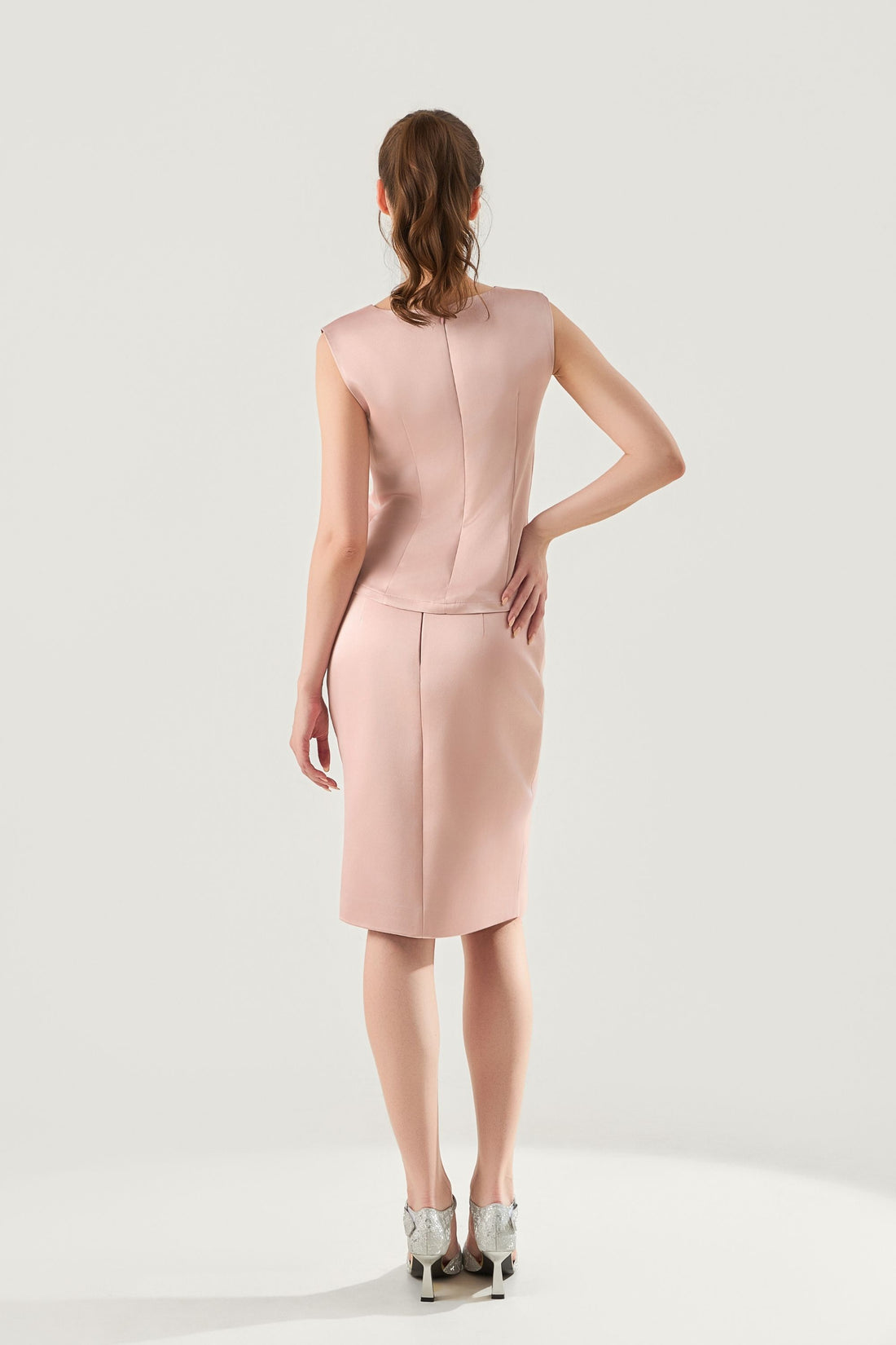 She is wearing Aurelia Sculpted Polysilk Top at VandaMod