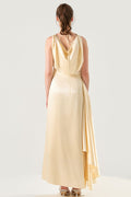 She is wearing  Celeste Champagne Polysilk Dress at VandaMod