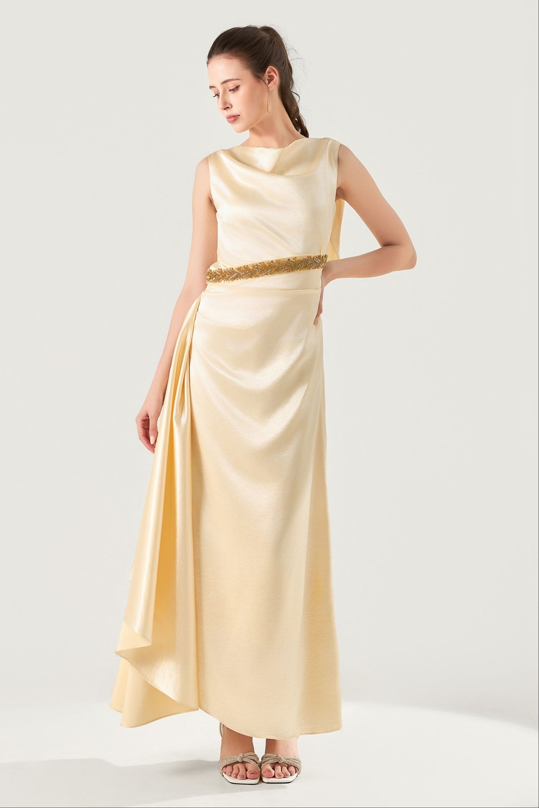 She is wearing  Celeste Champagne Polysilk Dress at VandaMod