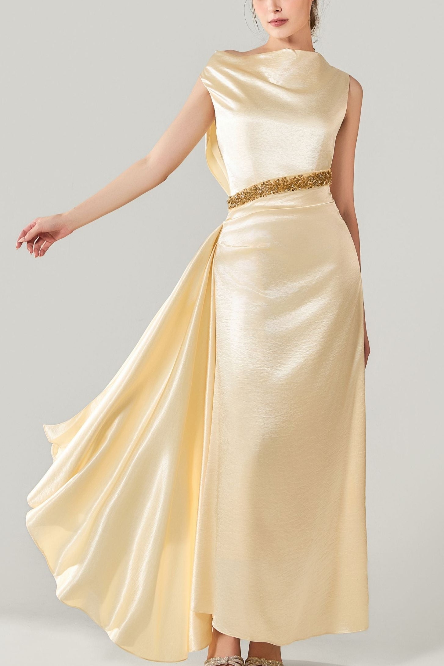 She is wearing  Celeste Champagne Polysilk Dress at VandaMod