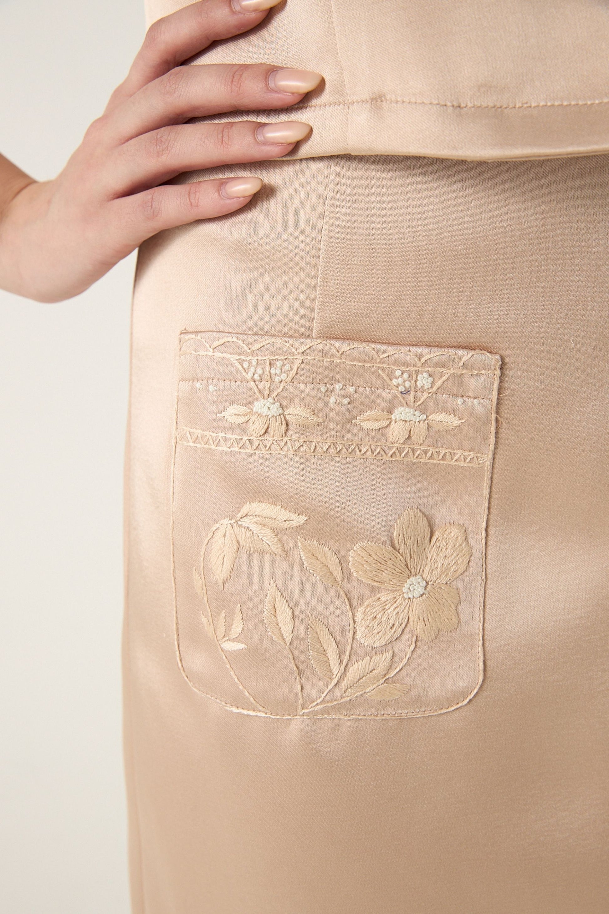 She is wearing Clara Embroidered Polysilk Skirt at VandaMod