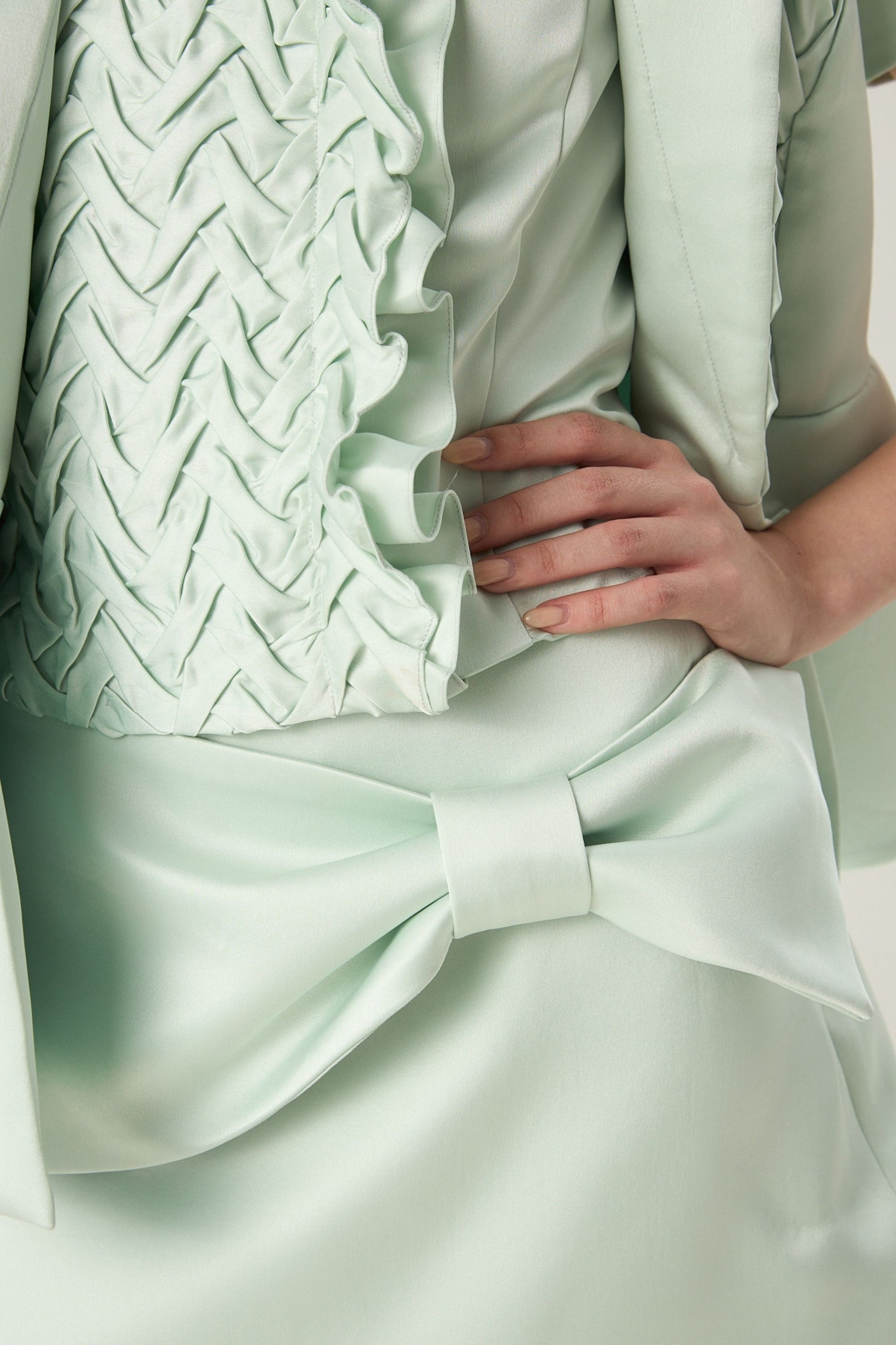 She is wearing Elara Adjustable Bow Polysilk Skirt at vandaMod