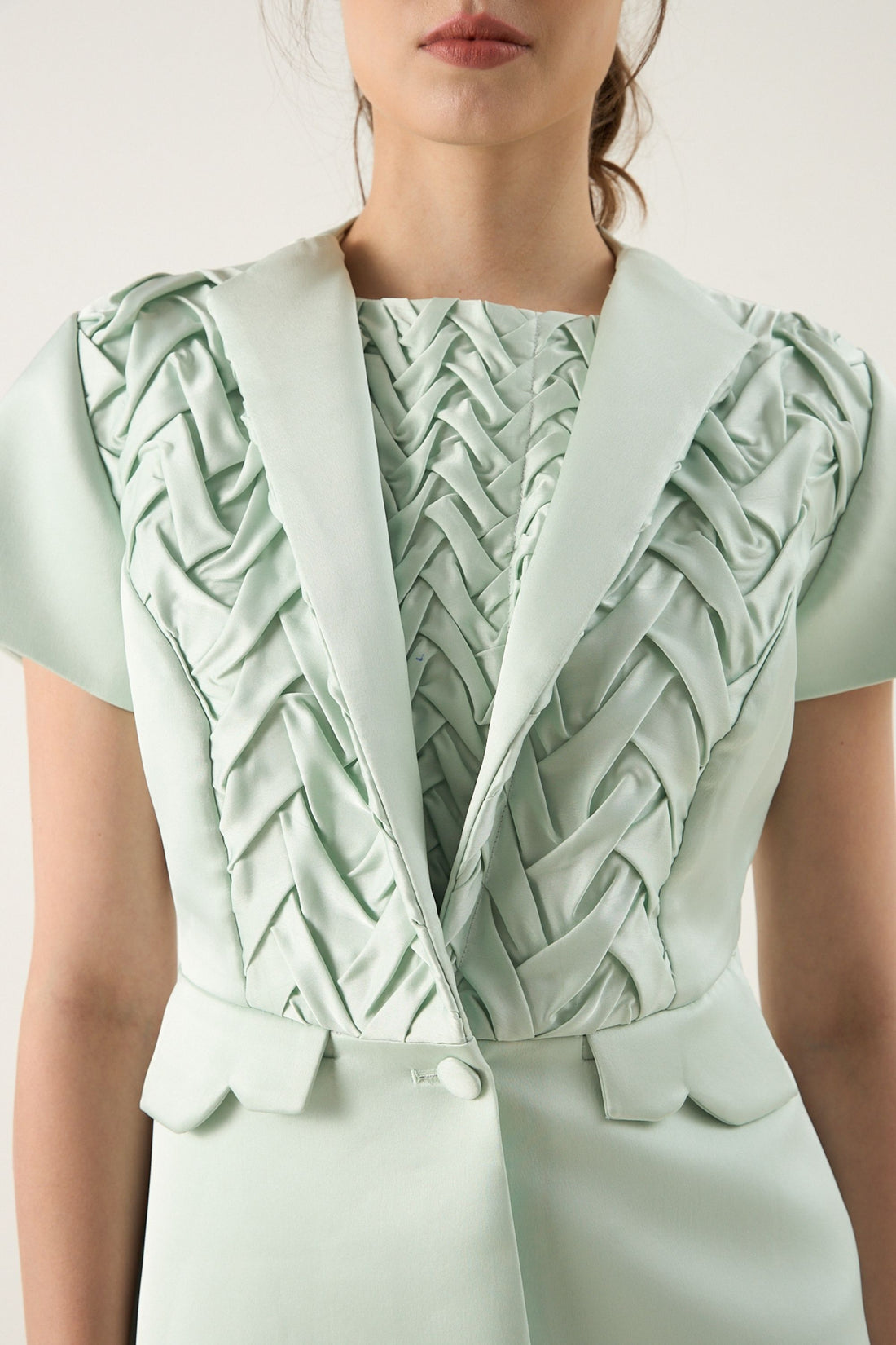 She is wearing Elara Hand-Smocked Polysilk Blazer at VandaMod