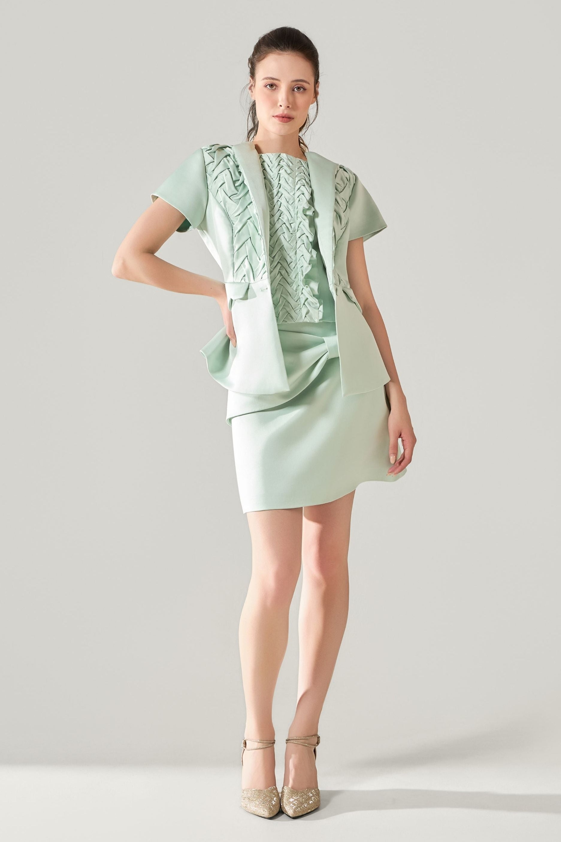 She is wearing Elara Hand-Smocked Polysilk Top at VandaMod