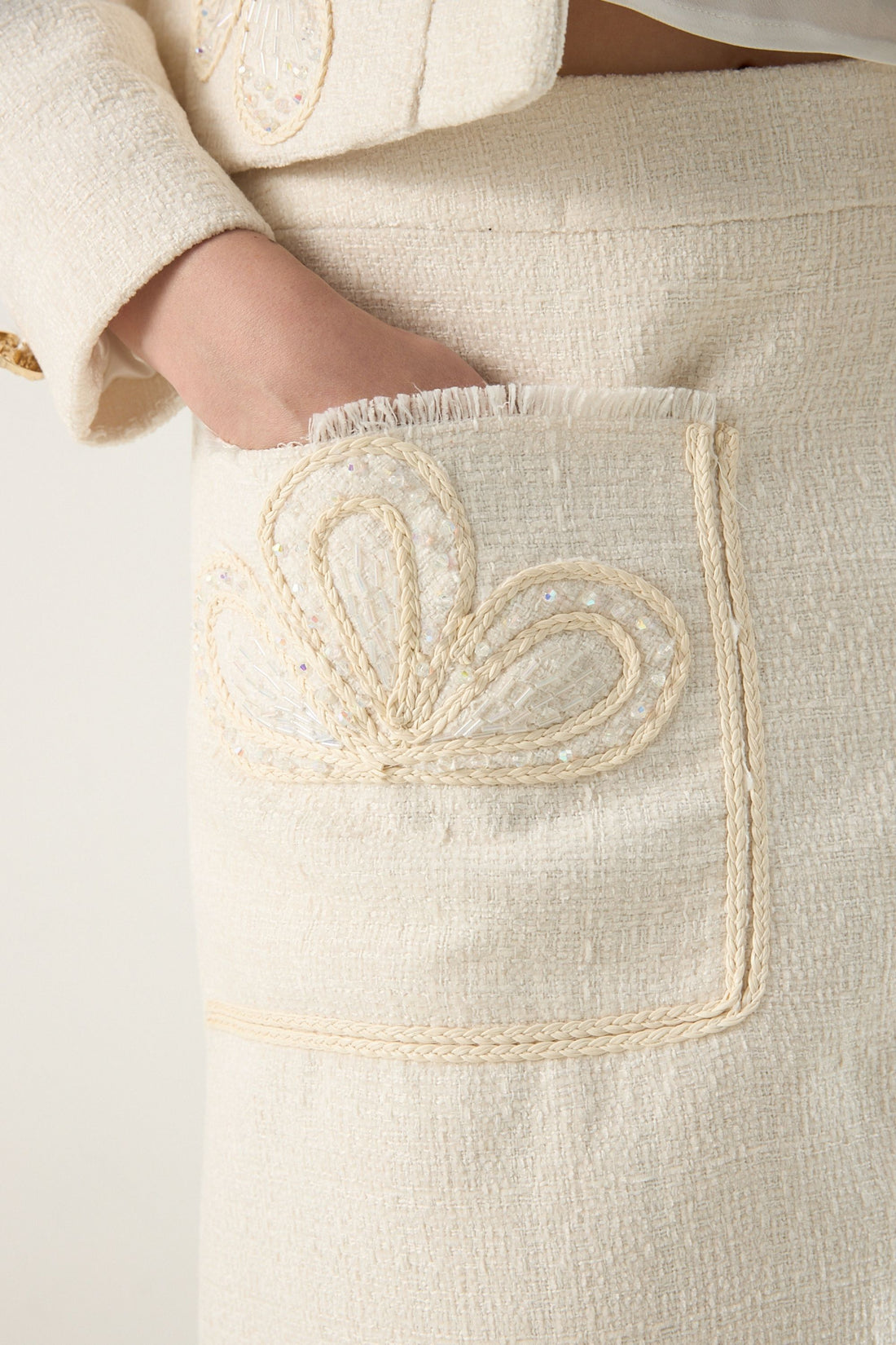 She is wearing Elise Braided Tweed Skirt at VandaMod