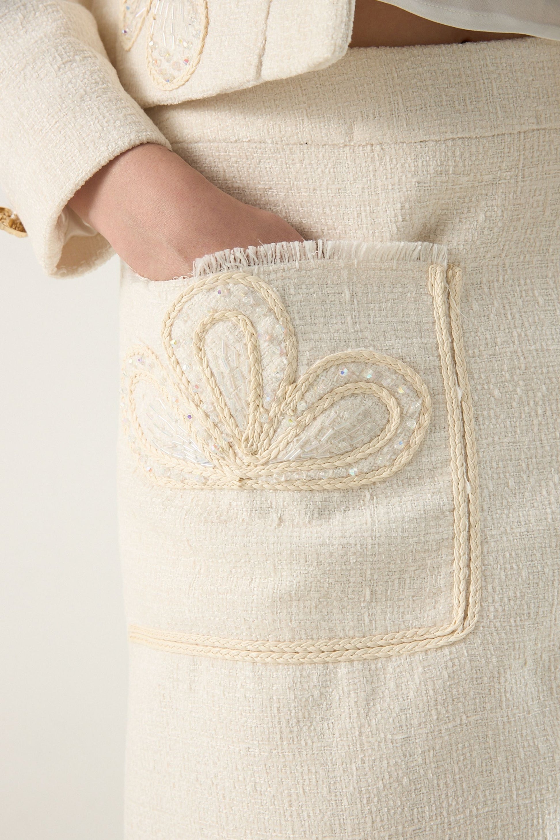 She is wearing Elise Braided Tweed Skirt at VandaMod