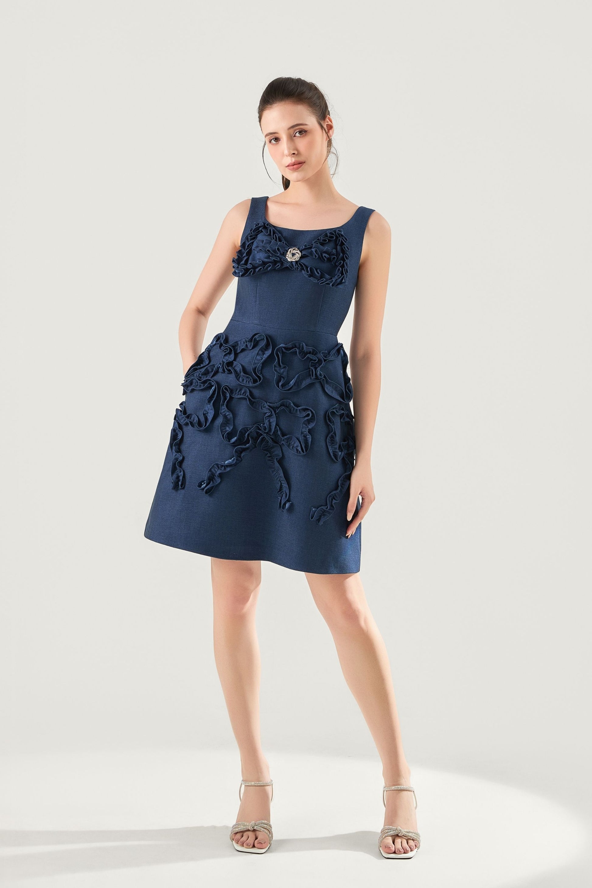 Woman wearing Luna_Sculpted_Denim_Dress, which is a navy blue dress with floral details at VandaMod 