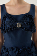 Woman wearing Luna_Sculpted_Denim_Dress, which is a navy blue dress with floral details at VandaMod 