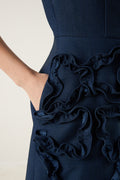 Woman wearing Luna_Sculpted_Denim_Dress, which is a navy blue dress with floral details at VandaMod 