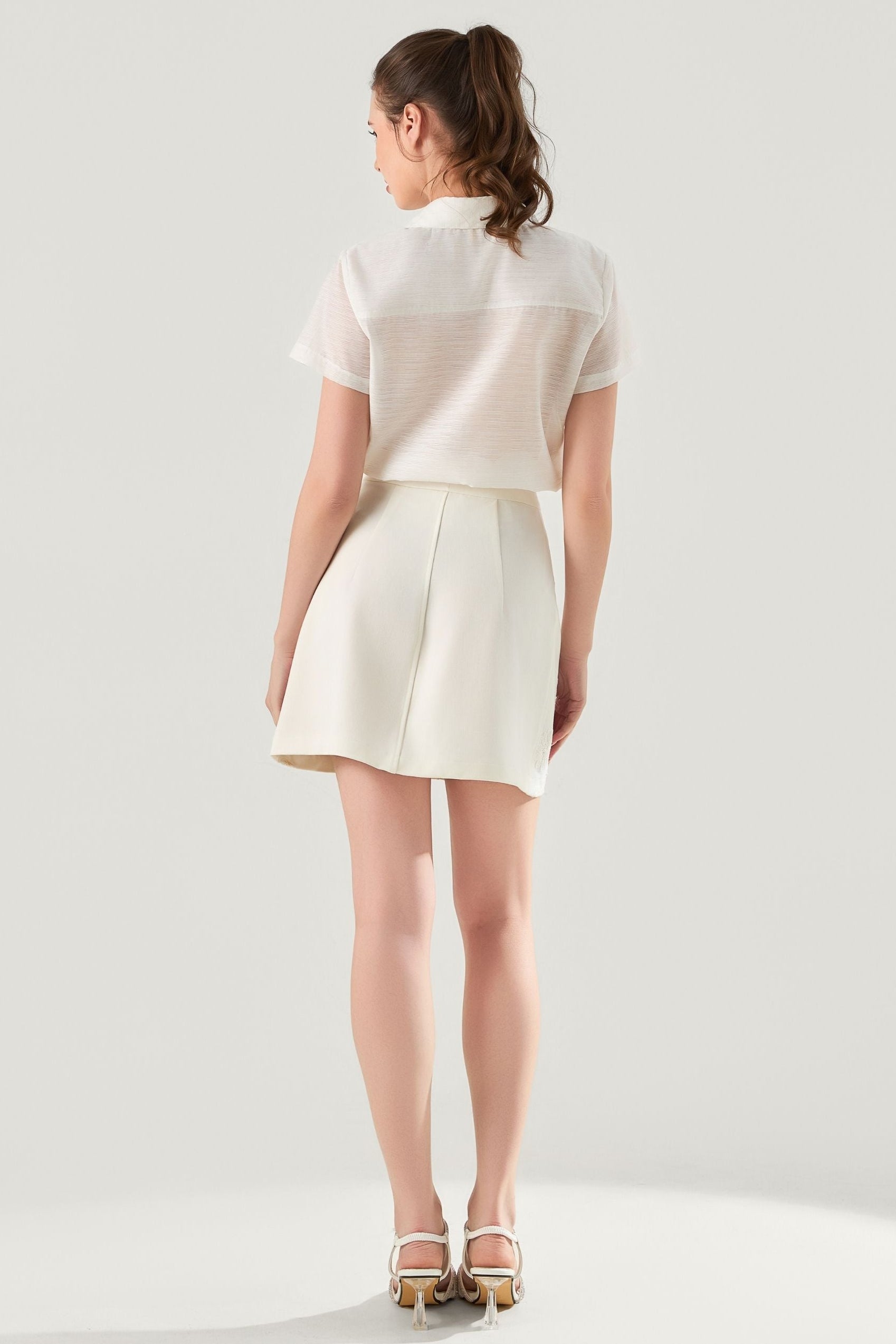 She is wearing  Muse Bow Statement Top at VandaMod