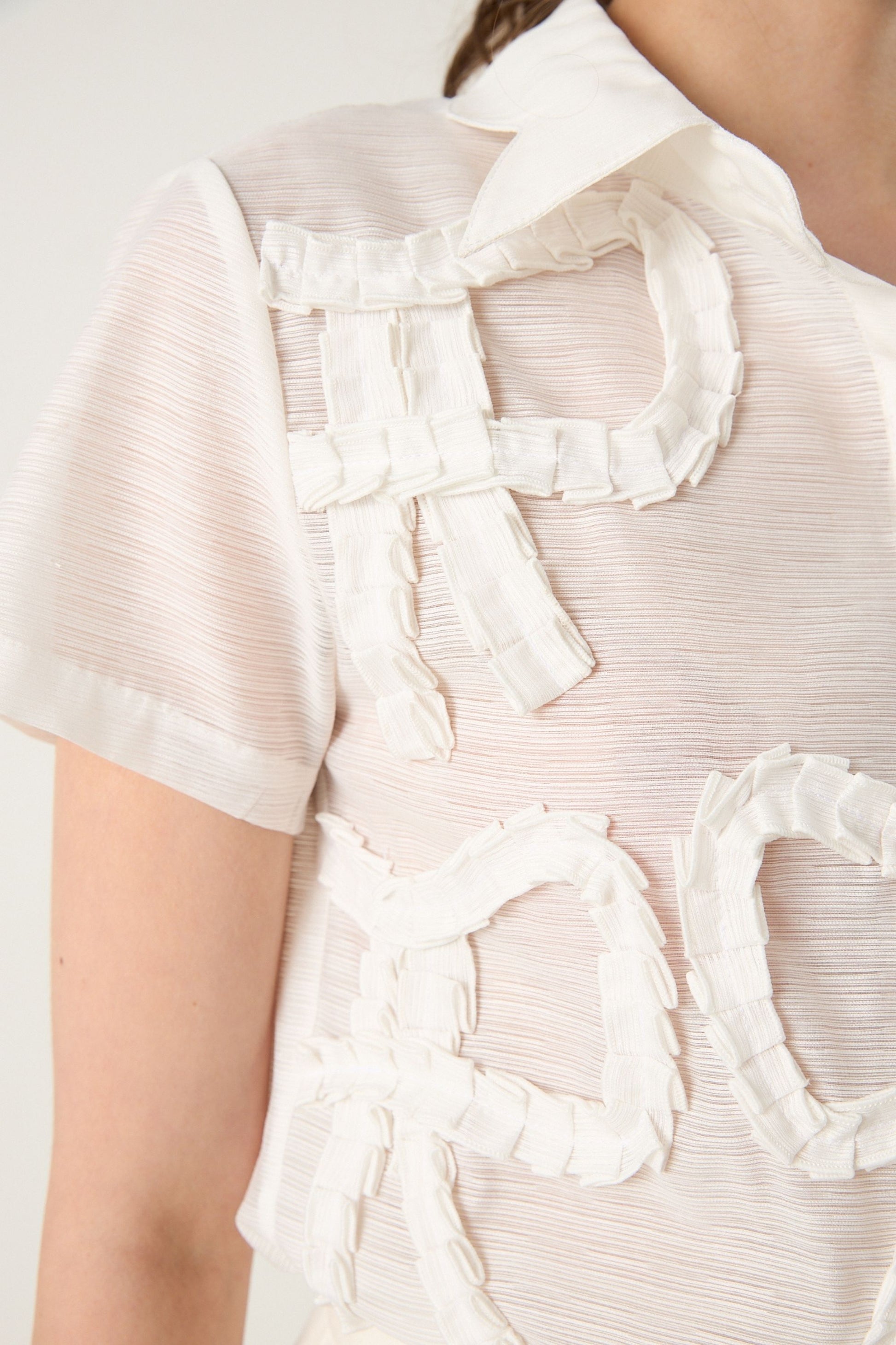 She is wearing  Muse Bow Statement Top at VandaMod