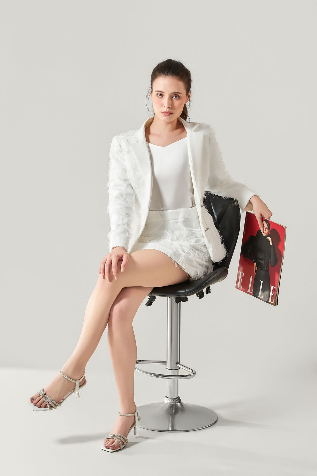 She is wearing Stella Appliqué Statement Skirt at VandaMod