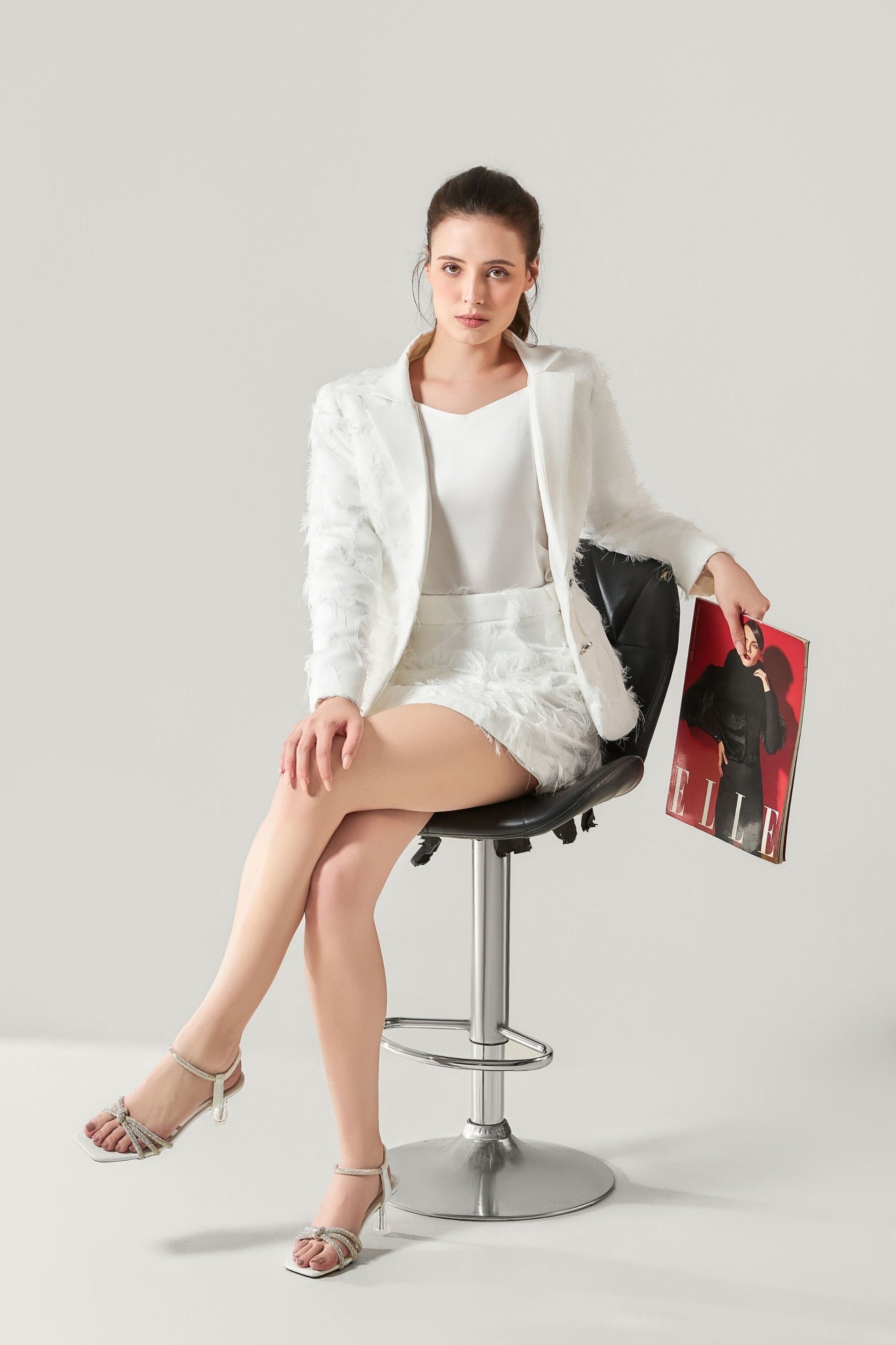 She is wearing Stella Appliqué Statement Skirt at VandaMod